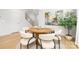 Bright dining area featuring a round table, modern chairs, and elegant decor at 3888 12Th Ne St, Hickory, NC 28601