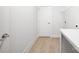 Convenient laundry room with open storage space, utility sink, and hard floors at 3888 12Th Ne St, Hickory, NC 28601
