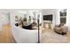 Open living area blending the dining area with a modern sofa, bright windows, and contemporary decor at 3888 12Th Ne St, Hickory, NC 28601