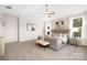 Stylish main bedroom with vaulted ceiling, natural light, neutral tones, and modern decor at 3888 12Th Ne St, Hickory, NC 28601
