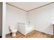 Bright bathroom features a toilet and separate bathtub, with neutral tones and wood-look flooring at 445 Davis Rd, Shelby, NC 28152