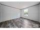 This bedroom features hard flooring, a window, and neutral walls at 445 Davis Rd, Shelby, NC 28152