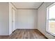 Cozy bedroom with wood-look flooring and a window with views creating a peaceful retreat at 445 Davis Rd, Shelby, NC 28152