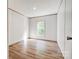 Inviting bedroom features natural light, neutral decor, and wood-look flooring at 445 Davis Rd, Shelby, NC 28152