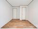 Bedroom with wood-look flooring and two doors provides ample space for personalization at 445 Davis Rd, Shelby, NC 28152