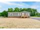 Charming single-story home with a inviting front porch and nicely maintained lawn at 445 Davis Rd, Shelby, NC 28152