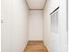 Hallway featuring vinyl laminate flooring, light walls, and a closet at 445 Davis Rd, Shelby, NC 28152