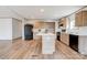 Modern kitchen with island, wooden cabinets, sleek appliances, and ample counter space at 445 Davis Rd, Shelby, NC 28152
