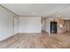 Large living space with wood-look flooring leading to kitchen area at 445 Davis Rd, Shelby, NC 28152