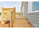 Close up of the home's porch with wooden railings and stairs at 445 Davis Rd, Shelby, NC 28152