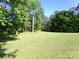 Spacious backyard with manicured lawn and mature trees at 44716 Gold Branch Rd, Richfield, NC 28137