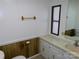 Bathroom with white vanity, window and a toilet at 44716 Gold Branch Rd, Richfield, NC 28137