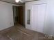 Bedroom with a large closet and a view into another room at 44716 Gold Branch Rd, Richfield, NC 28137