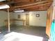 A bright garage interior, featuring exposed wood beams, and a wooden workbench at 44716 Gold Branch Rd, Richfield, NC 28137
