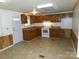 Open kitchen area with wood cabinets and appliances, with ample counter space at 44716 Gold Branch Rd, Richfield, NC 28137