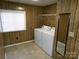Laundry room featuring a washer, dryer, mirror and vinyl floors at 44716 Gold Branch Rd, Richfield, NC 28137