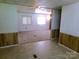 An open-concept living area, featuring neutral paint, ceiling fan and carpet flooring at 44716 Gold Branch Rd, Richfield, NC 28137