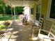 Inviting covered porch with multiple rocking chairs, perfect for relaxing and enjoying the outdoors at 44716 Gold Branch Rd, Richfield, NC 28137