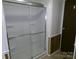 Bright white shower with glass doors and chrome trim at 44716 Gold Branch Rd, Richfield, NC 28137