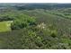 An aerial view highlights this property's woodland acreage with mature trees, promising seclusion and scenic views at 4815 Nc 109 Hwy, Wadesboro, NC 28170