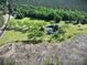 Aerial view of a beautiful two-story home surrounded by lush green lawns and mature trees at 4815 Nc 109 Hwy, Wadesboro, NC 28170