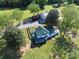Stunning aerial view of the home, featuring a green metal roof and landscaped yard, plus detached garage at 4815 Nc 109 Hwy, Wadesboro, NC 28170