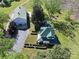 Charming aerial view of home with landscaped yard, green roof and detached garage at 4815 Nc 109 Hwy, Wadesboro, NC 28170