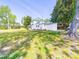Exterior view of the two-story home surrounded by a large green lawn and mature trees at 4815 Nc 109 Hwy, Wadesboro, NC 28170