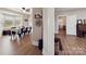 Sun-filled dining room featuring hardwood floors, a large window, and a farmhouse style table at 4815 Nc 109 Hwy, Wadesboro, NC 28170