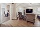 Comfortable living room featuring hardwood floors, a fireplace, and cozy seating at 4815 Nc 109 Hwy, Wadesboro, NC 28170