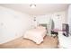 Bright bedroom featuring a bed, white furniture, and a decorative green accent wall at 539 30Th Nw Ave, Hickory, NC 28601