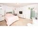 Bedroom with pink bedspread, white dresser, and a decorative cactus themed wall at 539 30Th Nw Ave, Hickory, NC 28601