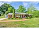 Charming brick ranch-style home with a well-manicured lawn and inviting front porch at 539 30Th Nw Ave, Hickory, NC 28601