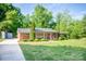 Charming brick ranch-style home with a well-manicured lawn and inviting front porch at 539 30Th Nw Ave, Hickory, NC 28601