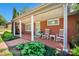 Inviting covered front porch featuring rocking chairs and brick flooring, perfect for relaxing outdoors at 539 30Th Nw Ave, Hickory, NC 28601