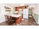 Well-lit kitchen featuring an island with bar seating and stainless steel appliances at 539 30Th Nw Ave, Hickory, NC 28601