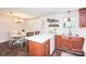 Bright kitchen with updated counters and dining area featuring a classic chandelier and table setting at 539 30Th Nw Ave, Hickory, NC 28601
