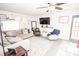 Bright living room with a large sectional sofa, accent chairs, and mounted TV at 539 30Th Nw Ave, Hickory, NC 28601