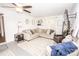 Bright living room with a large sectional sofa, accent chairs, and mounted TV at 539 30Th Nw Ave, Hickory, NC 28601
