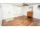 Bright living room featuring hardwood floors, a ceiling fan, and a front door entrance at 539 30Th Nw Ave, Hickory, NC 28601