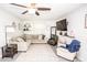 Bright living room with a large sectional sofa, accent chairs, and ceiling fan at 539 30Th Nw Ave, Hickory, NC 28601