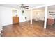 Open-concept living area with wood floors flowing into the dining and kitchen spaces at 539 30Th Nw Ave, Hickory, NC 28601