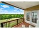 Scenic backyard view from the deck showcasing a beautifully manicured golf course and mature trees at 54053 Flycatchers Ct, Fort Mill, SC 29707