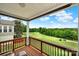 Relaxing backyard view from the deck with a golf course, blue sky, and mature trees at 54053 Flycatchers Ct, Fort Mill, SC 29707