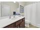 Bathroom with a white countertop vanity, wooden cabinets, and neutral wall paint at 54053 Flycatchers Ct, Fort Mill, SC 29707