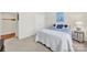 Comfortable bedroom with blue accents and a side table next to a window at 54053 Flycatchers Ct, Fort Mill, SC 29707