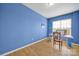 Bonus room features hardwood floors, a bright window, and a desk at 54053 Flycatchers Ct, Fort Mill, SC 29707