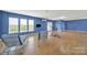 Spacious bonus room with a seating area, exercise equipment, and three large windows at 54053 Flycatchers Ct, Fort Mill, SC 29707