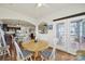 Bright breakfast nook with a wooden table, access to a deck, and an archway to the kitchen at 54053 Flycatchers Ct, Fort Mill, SC 29707