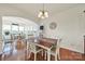 Dining room with views into the eat-in kitchen and spacious sun room at 54053 Flycatchers Ct, Fort Mill, SC 29707